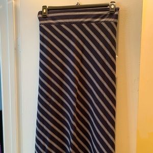 Long, flowing, navy and white pin stripe skirt.